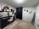 Cozy bedroom with makeup vanity, mirror, black out curtains, and carpet flooring at 6432 Polar Fox Ct, Riverdale, GA 30296
