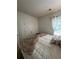 Bright bedroom featuring a bed, linen curtains, and closet at 6432 Polar Fox Ct, Riverdale, GA 30296