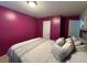 Inviting bedroom featuring neutral carpet, and an abundance of natural light at 6432 Polar Fox Ct, Riverdale, GA 30296