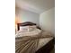 Bedroom with a large bed with lots of pillows and an elegant bed frame at 6432 Polar Fox Ct, Riverdale, GA 30296