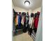 Walk-in closet with ample hanging space and organization at 6432 Polar Fox Ct, Riverdale, GA 30296