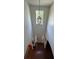 Dramatic foyer with a high ceiling, statement lighting, and hardwood floors at 6432 Polar Fox Ct, Riverdale, GA 30296