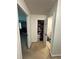 Hallway view with doors open leading to rooms and closets at 6432 Polar Fox Ct, Riverdale, GA 30296