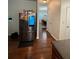 Stainless steel refrigerator inside a kitchen overlooking the dining area and door access at 6432 Polar Fox Ct, Riverdale, GA 30296