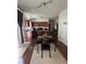 Open kitchen and dining area featuring wooden cabinets, stainless steel appliances, and a door to a pantry at 6432 Polar Fox Ct, Riverdale, GA 30296