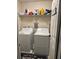 Laundry room with washer, dryer, shelving and decor at 6432 Polar Fox Ct, Riverdale, GA 30296