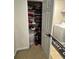 Cozy laundry area with a washer, dryer and storage shelves at 6432 Polar Fox Ct, Riverdale, GA 30296