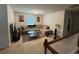 Inviting living room featuring neutral walls, carpet, and a comfortable sofa set with a coffee table at 6432 Polar Fox Ct, Riverdale, GA 30296