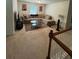 Inviting living room featuring neutral walls, carpet, and a comfortable sofa set with a coffee table at 6432 Polar Fox Ct, Riverdale, GA 30296