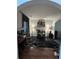 Stylish bar room area with dark marble floors, trendy decor, and ample storage for beverages and glassware at 6432 Polar Fox Ct, Riverdale, GA 30296