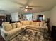 Comfortable living room showcasing a plush sectional sofa, stylish area rug, and inviting decor at 6432 Polar Fox Ct, Riverdale, GA 30296