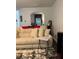 Cozy living room highlighting a comfortable sectional sofa, stylish tables, and views of the home's interior at 6432 Polar Fox Ct, Riverdale, GA 30296