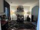 Stylish bar room area with dark marble floors, trendy decor, and ample storage for beverages and glassware at 6432 Polar Fox Ct, Riverdale, GA 30296