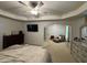 A large main bedroom boasts a ceiling fan, sitting area, and plenty of space at 6432 Polar Fox Ct, Riverdale, GA 30296