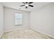 Bright bedroom with a ceiling fan and a window that has blinds for privacy and light control at 1384 Dolcetto Nw Trce, Kennesaw, GA 30152