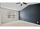 Spacious bedroom with vaulted ceiling, ceiling fan, and large window at 1384 Dolcetto Nw Trce, Kennesaw, GA 30152