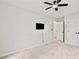 Bright bedroom with ceiling fan, wall-mounted TV, and a double door closet for ample storage at 1384 Dolcetto Nw Trce, Kennesaw, GA 30152