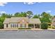 Community clubhouse featuring brick facade, covered area, and ample parking at 1384 Dolcetto Nw Trce, Kennesaw, GA 30152