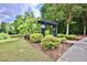 Community dog park with a pergola, bushes, trees, and walking path at 1384 Dolcetto Nw Trce, Kennesaw, GA 30152