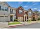A row of charming townhomes, each featuring a one-car garage and well-kept lawns at 1384 Dolcetto Nw Trce, Kennesaw, GA 30152