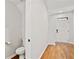 Entryway featuring a toilet, sink, and the home's front door at 1384 Dolcetto Nw Trce, Kennesaw, GA 30152
