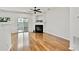 Spacious living room with hardwood floors, fireplace, and access to the backyard at 1384 Dolcetto Nw Trce, Kennesaw, GA 30152