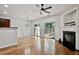 Bright living room with hardwood floors, fireplace, and sliding glass doors to outdoor space at 1384 Dolcetto Nw Trce, Kennesaw, GA 30152