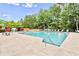 Sparkling community pool surrounded by lounge chairs and lush greenery for relaxation at 1384 Dolcetto Nw Trce, Kennesaw, GA 30152