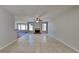 Large living room featuring tile floors, a ceiling fan, and a fireplace at 145 Charleston Pl, Covington, GA 30016