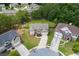 Aerial view of a beautiful home with a well-manicured lawn and mature trees at 1548 Station Ridge Dr, Lawrenceville, GA 30045