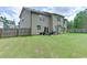 Backyard with patio and spacious lawn area at 1548 Station Ridge Dr, Lawrenceville, GA 30045