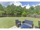 Backyard with green lawn, fence and patio at 1548 Station Ridge Dr, Lawrenceville, GA 30045