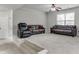 Finished basement with sitting area and multiple couches at 1548 Station Ridge Dr, Lawrenceville, GA 30045