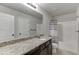 Bathroom with a combination shower and tub, and granite countertop at 1548 Station Ridge Dr, Lawrenceville, GA 30045