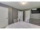 Neutral painted bedroom with plush carpet, a television, and modern design at 1548 Station Ridge Dr, Lawrenceville, GA 30045