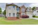 Charming two-story home featuring a manicured lawn, brick accents, and an attached two-car garage at 1548 Station Ridge Dr, Lawrenceville, GA 30045