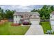 Charming two-story home with a well-manicured lawn, attached garage, and inviting curb appeal at 1548 Station Ridge Dr, Lawrenceville, GA 30045