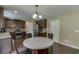 Eat-in kitchen includes stainless steel appliances and dark wood cabinets at 1548 Station Ridge Dr, Lawrenceville, GA 30045