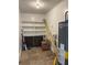 Storage room with built-in shelving, water heater, and ample space for organizing belongings at 2103 River Rd, Ellenwood, GA 30294