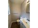 Bathroom featuring a white single sink vanity with white toilet at 2830 Norgate Ln, Decatur, GA 30034