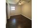 This bedroom has hard wood floors and a window at 2830 Norgate Ln, Decatur, GA 30034