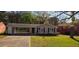 A well-kept single-story house boasts a convenient carport and tidy landscaping, offering curb appeal at 2830 Norgate Ln, Decatur, GA 30034