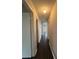 Hallway with hardwood floors and access to multiple rooms at 2830 Norgate Ln, Decatur, GA 30034