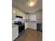 Bright kitchen features white cabinets, granite countertops, and stainless steel appliances at 2830 Norgate Ln, Decatur, GA 30034