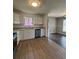 Cozy eat-in kitchen with stainless steel dishwasher, wood floors, and natural light at 2830 Norgate Ln, Decatur, GA 30034