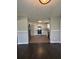 Bright kitchen with white cabinets, stainless steel appliances, and an open view to the living and dining areas at 2830 Norgate Ln, Decatur, GA 30034