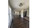 Open-concept living space with gleaming hardwood floors, connecting seamlessly to the dining area and kitchen at 2830 Norgate Ln, Decatur, GA 30034
