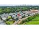 Aerial view of the neighborhood with many townhomes, green space, and a distant view of the city at 772 Aerial Se Way, Atlanta, GA 30312