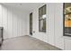 Outdoor balcony features white siding and black-framed windows, offering a modern aesthetic at 772 Aerial Se Way, Atlanta, GA 30312