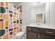 Stylish bathroom features a bright shower, colorful curtain and vanity at 772 Aerial Se Way, Atlanta, GA 30312
